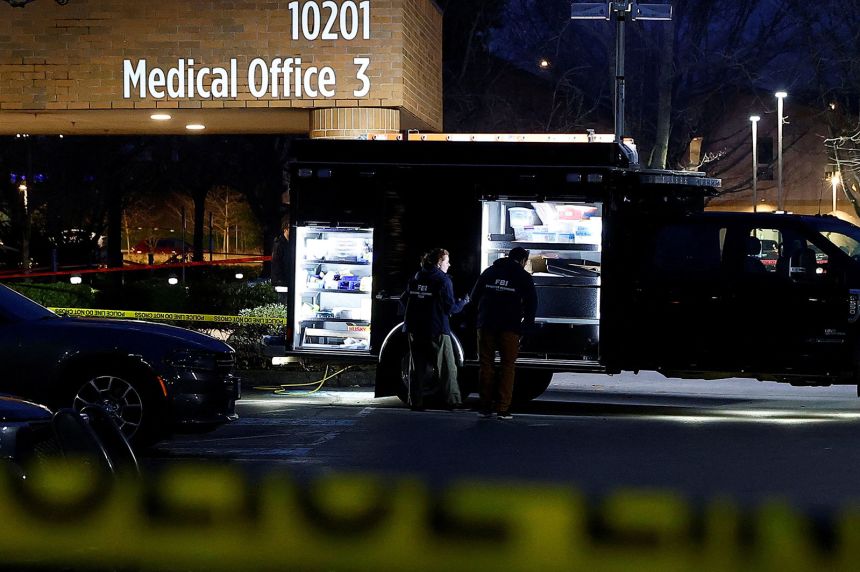 FBI agents work next to an evidence truck outside Adventist Hospital after US federal agents shot two people in Portland, Oregon, on Thursday.