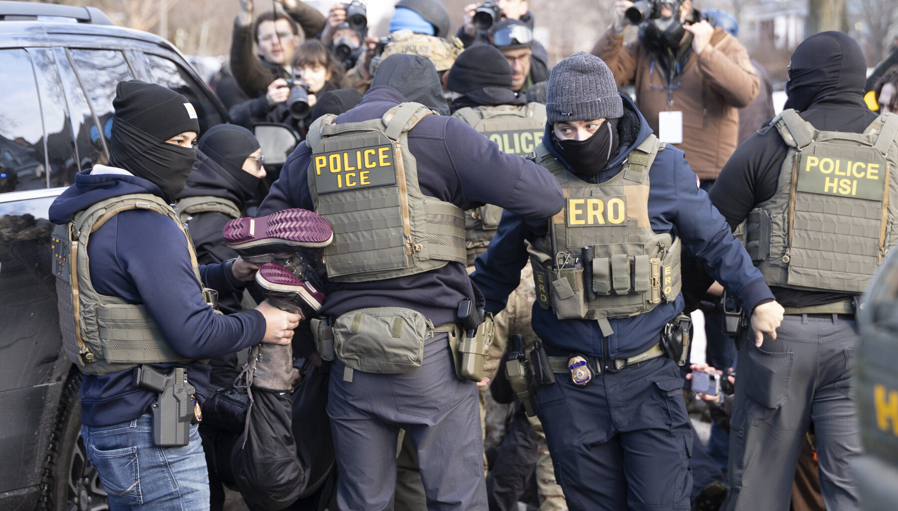 Crowd confronts immigration agents door-knocking in south Minneapolis