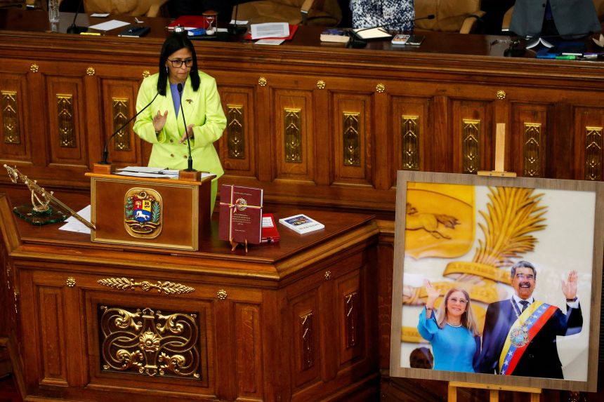 Venezuela's interim president Delcy Rodriguez applauds next to the picture of President Nicolas Maduro and his wife Cilia Flores, following the US strike in Caracas that resulted in their capture, in Caracas, Venezuela, on January 15.