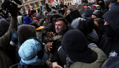 Jake Lang chased away by counterdemonstrators while leading small rally in Minneapolis