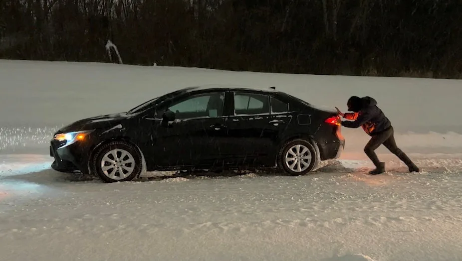 REUTERS A man pushes his car amidst snowfall as Winter Storm Fern leaves drivers stranded in Tulsa, Oklahoma, January 25, 2026, in this screen grab from video. REUTERS/Eric Cox