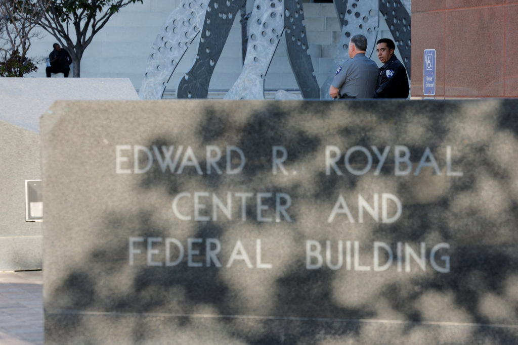 Security personnel stand guard outside the Roybal Federal courthouse after former CNN anchor Don Lemon was arrested for hi...