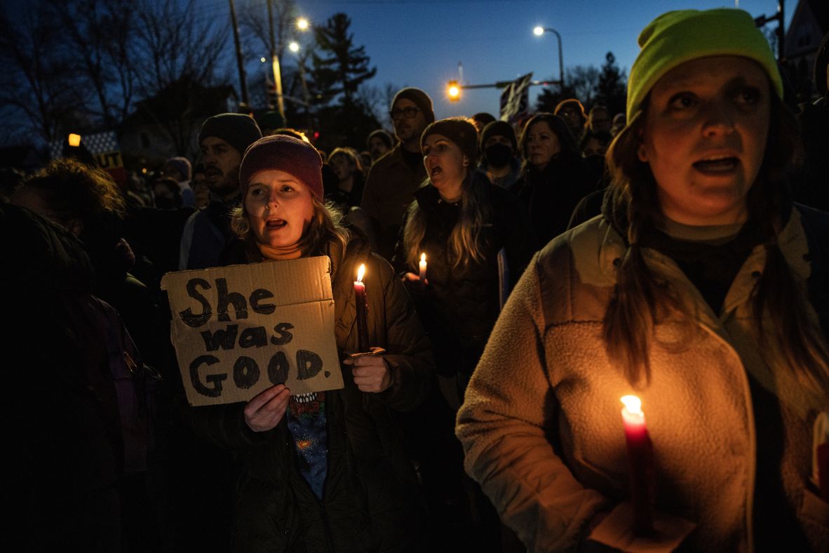 People gather for a vigil on the block in Minneapolis where Renee Good was fatally shot on January 7.