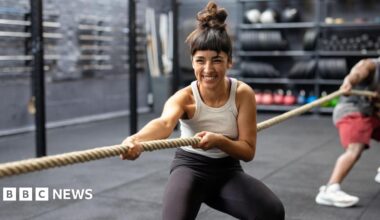 Woman being comforted at site of Gul plaza fire