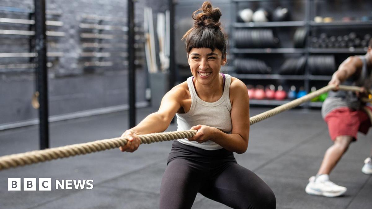 Woman being comforted at site of Gul plaza fire