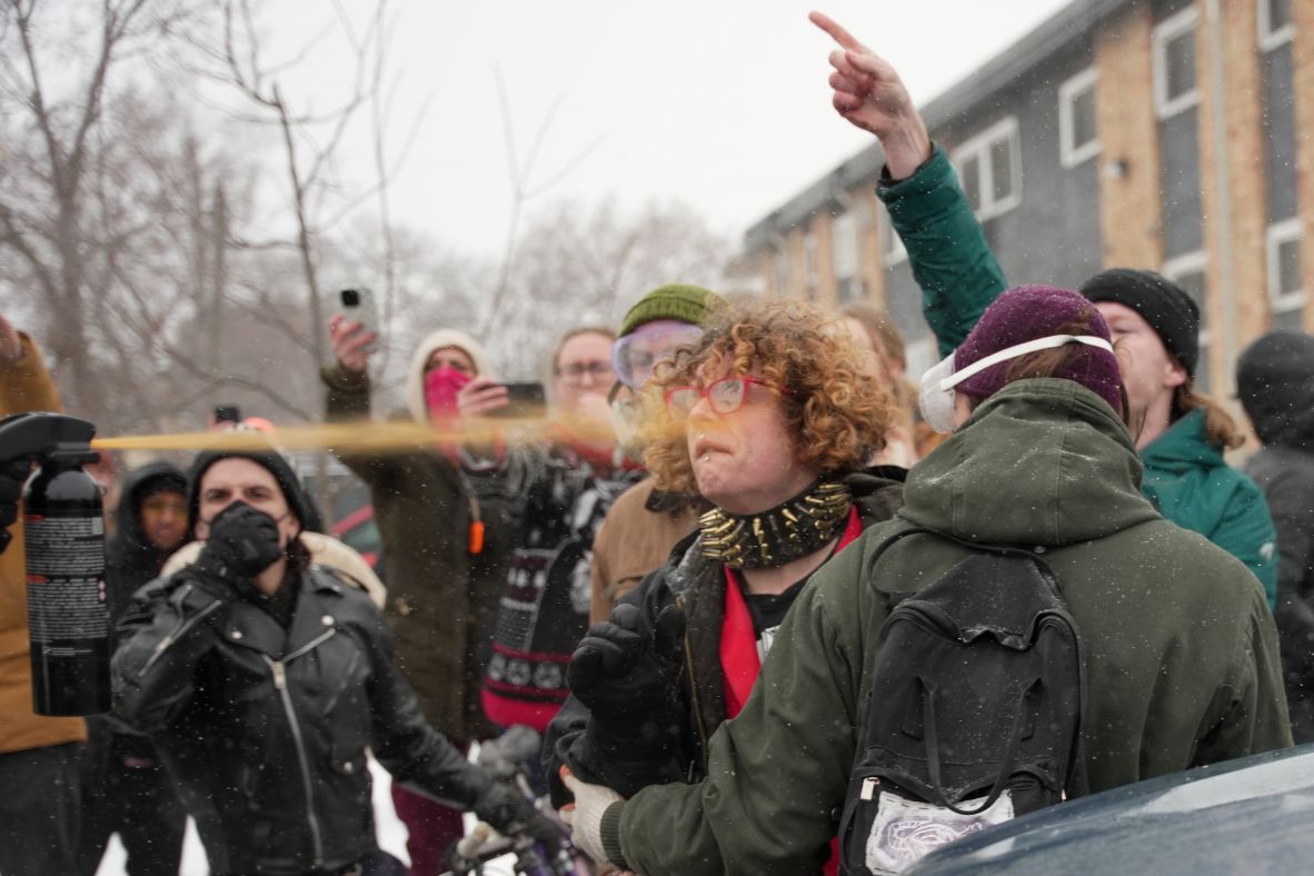 Federal agents spray a chemical agent at a person in Minneapolis on January 21.