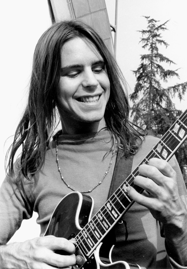 Bob Weir as a young man plays a guitar
