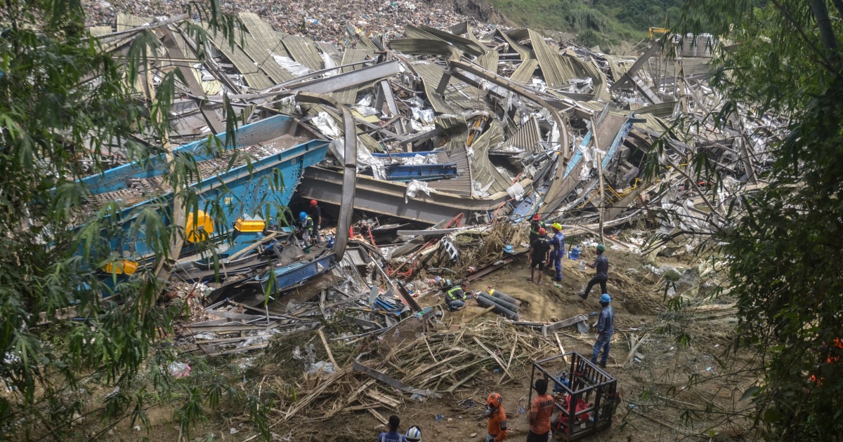Filipino rescuers detect 'signs of life' in garbage avalanche that killed 4 and left dozens missing