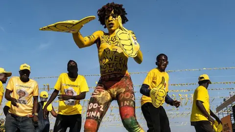 Bloomberg via Getty Images Supporters of Yoweri Museveni, Uganda's president, dance during a campaign rally ahead of presidential elections in Kampala, Uganda, on Tuesday, Jan. 13, 2026