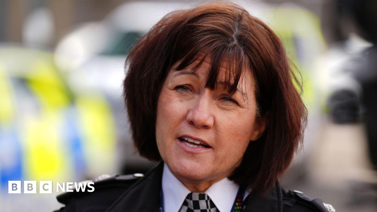 Prime Minister Mark Carney, wearing a black suit jacket, and a white button-up shirt leans his chin on his hands. He has short grey and black hair and is looking away from the camera.