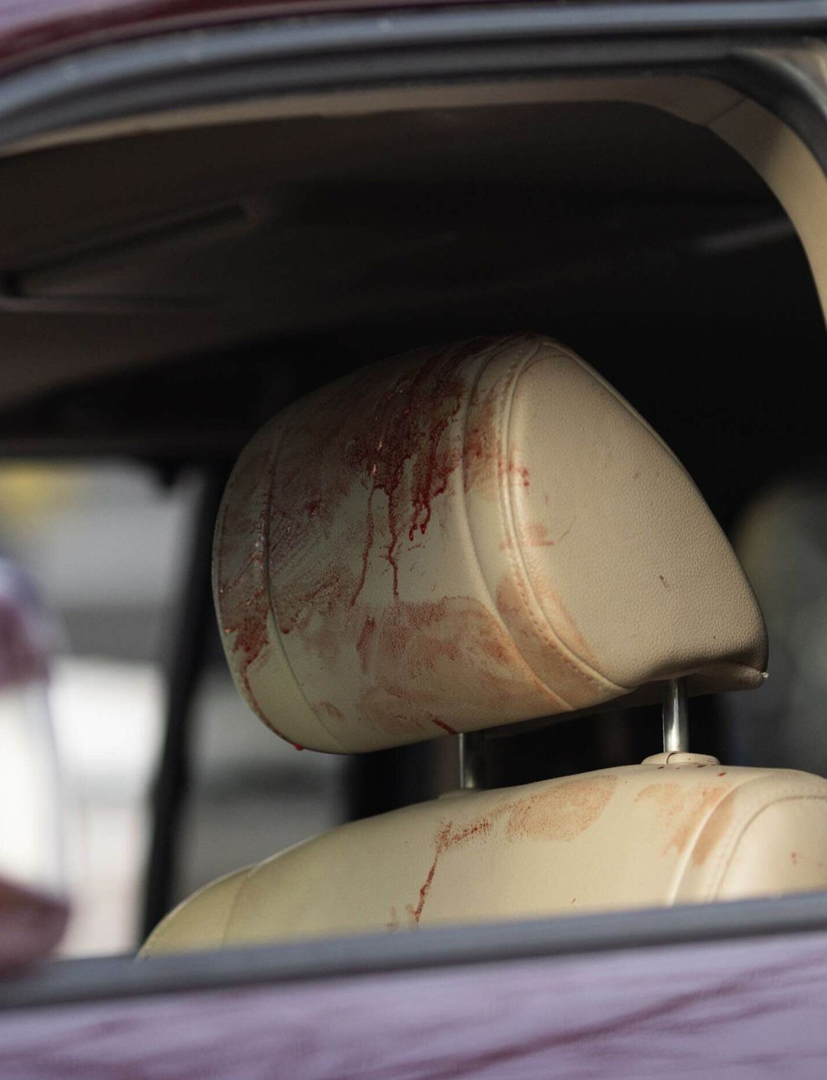 Blood is seen on the headrest of a vehicle at the scene of Renee Good's <a href=