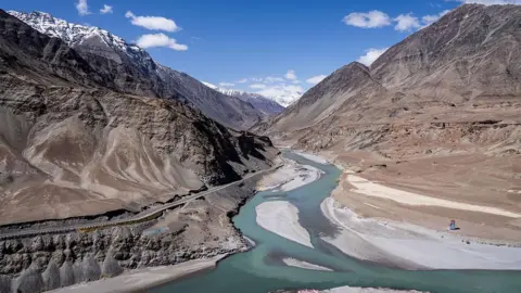 Getty Images A general view of a river running through the area with the Himalaya Mountains in the background in Leh, one of the most remote areas of the Indian-administered portion of the Kashmir region, on April 13, 2025.