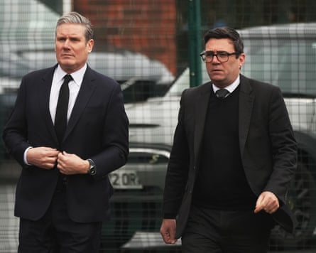 Starmer and Burnham dressed in black at the funeral of the former Labour MP for Rochdale Sir Tony Lloyd in Manchester, England, in February 2024