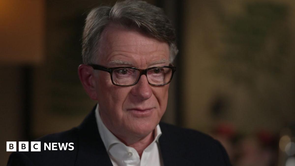 Side view close-up of pregnant woman touching her belly.