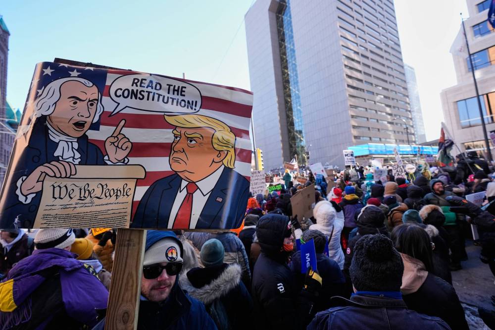 ALEX BRANDON / THE ASSOCIATED PRESS
People gather during a protest Friday in Minneapolis.