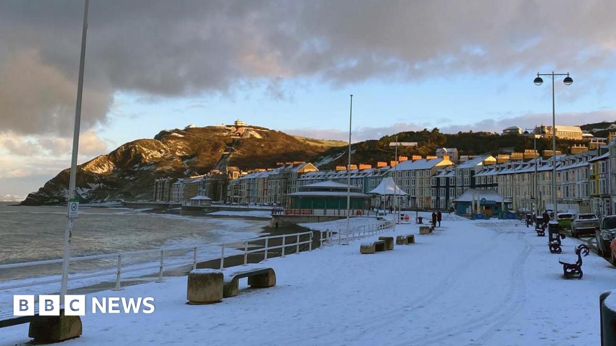 Snow on the ground on Aberystwyth promenade and beach