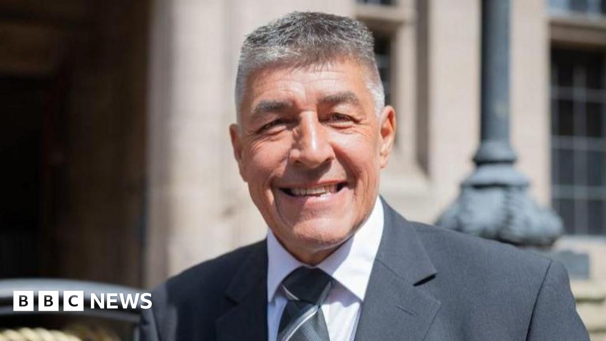 The front entrance to the Civic Centre in Stoke-on-Trent. The two sets of front doors and windows are made up of panels of grass. The words "civic centre" are above the entrance.