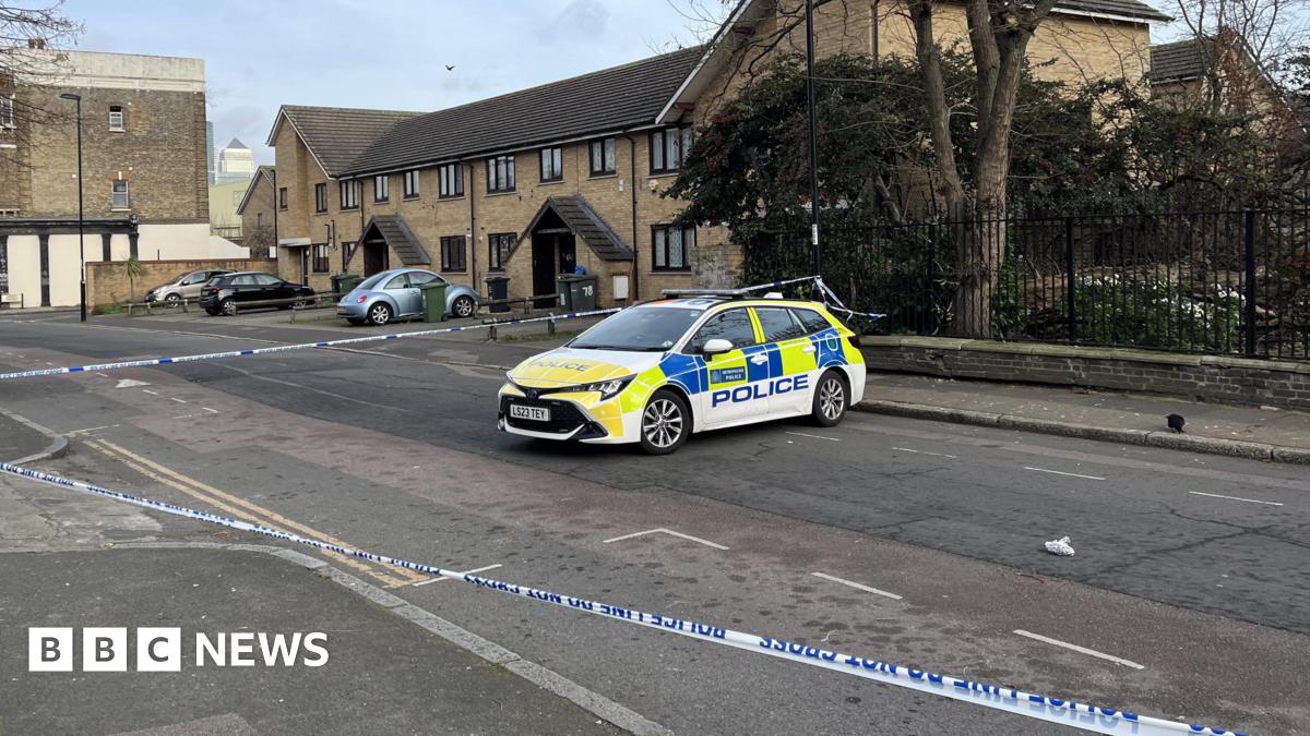 A police car within a cordon on Grove Street.