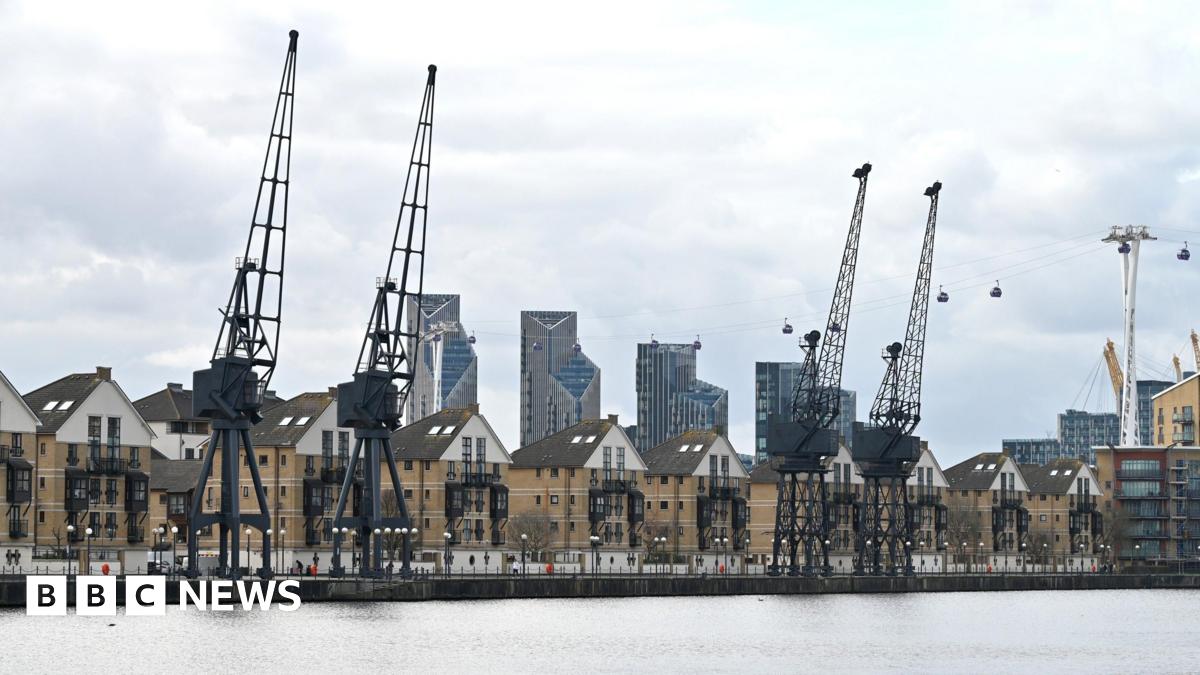 A general view of residential homes with Stothert and Pitt Cranes on the bank of Royal Victoria Dock and the IFS Cloud Cable Car.