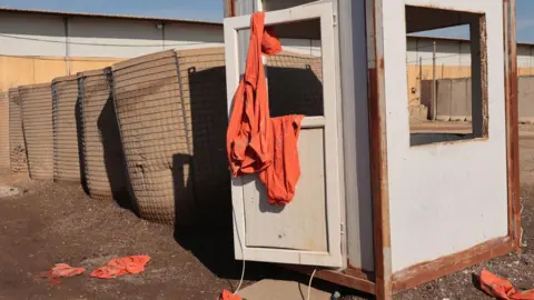EPA Abandoned orange prisoners' uniforms at Shaddadi prison in Hassakeh province, north-eastern Syria (20 January 2026)