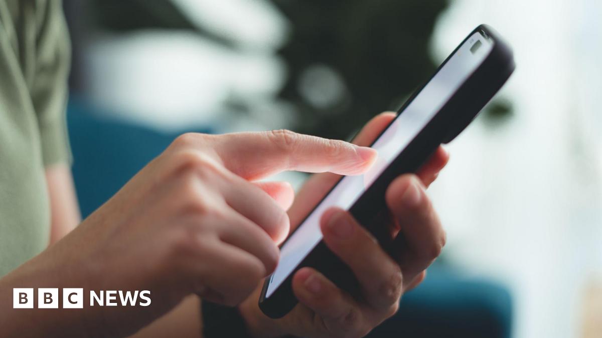 A close up of the hands of a person using a smartphone. They are tapping something on the screen.