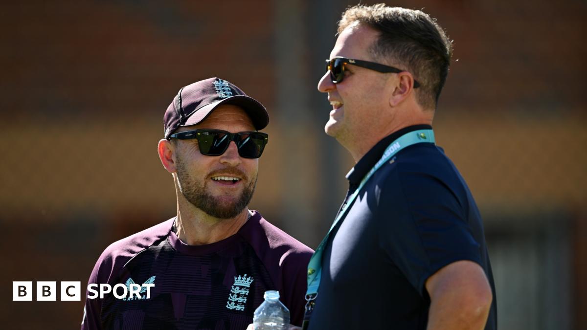 Brendon McCullum and Rob Key smile and look on