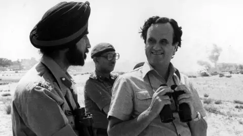 Sir Mark Tully with members of the Indian armed forces. 