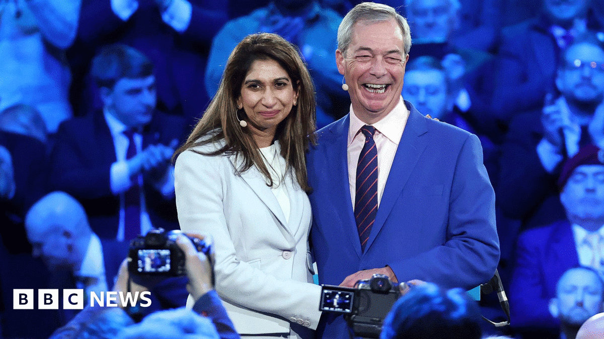 A photo of Paul Thompson being held by a person (his brother Eugene) whose hand and arm are visible