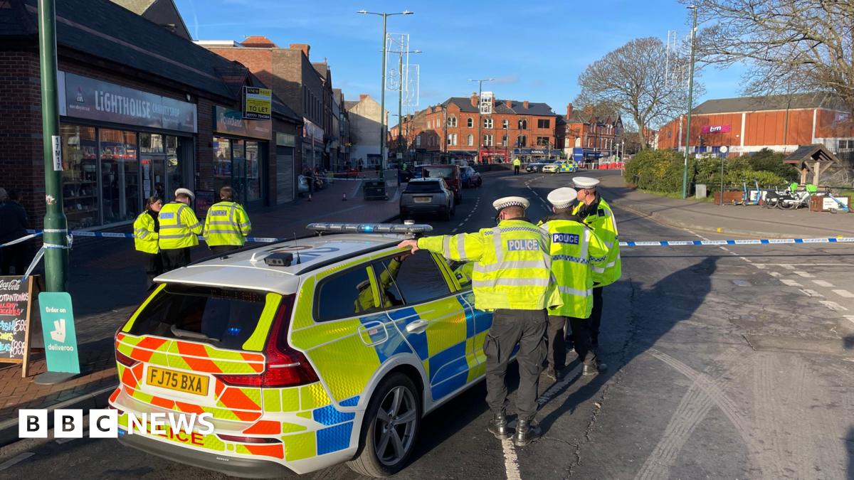 Several police officers and police car at the scene after three people were hit by a car in Main Street, Bulwell.