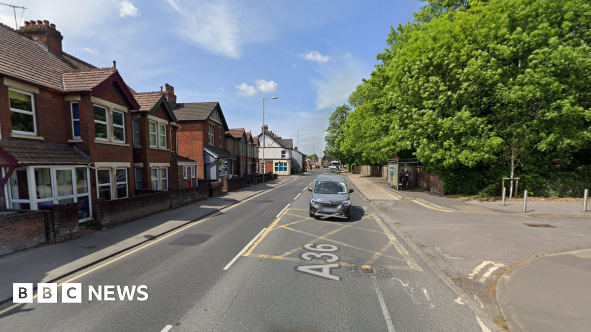 A Google Maps image of the A36 in Salisbury. It is a residential street and there are trees on one side of the road and houses on the other.