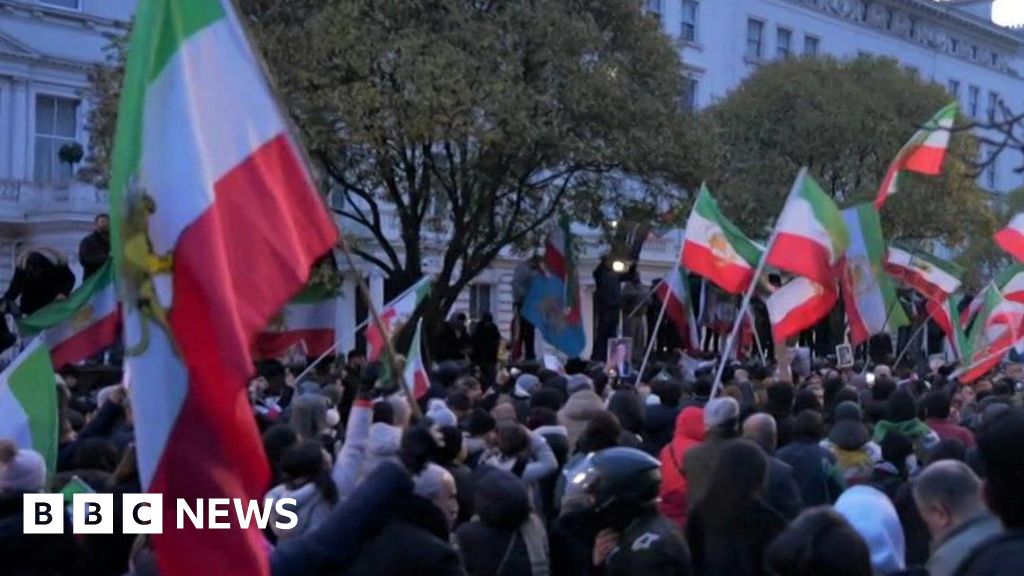 Protester climbs onto balcony of Iranian embassy in London