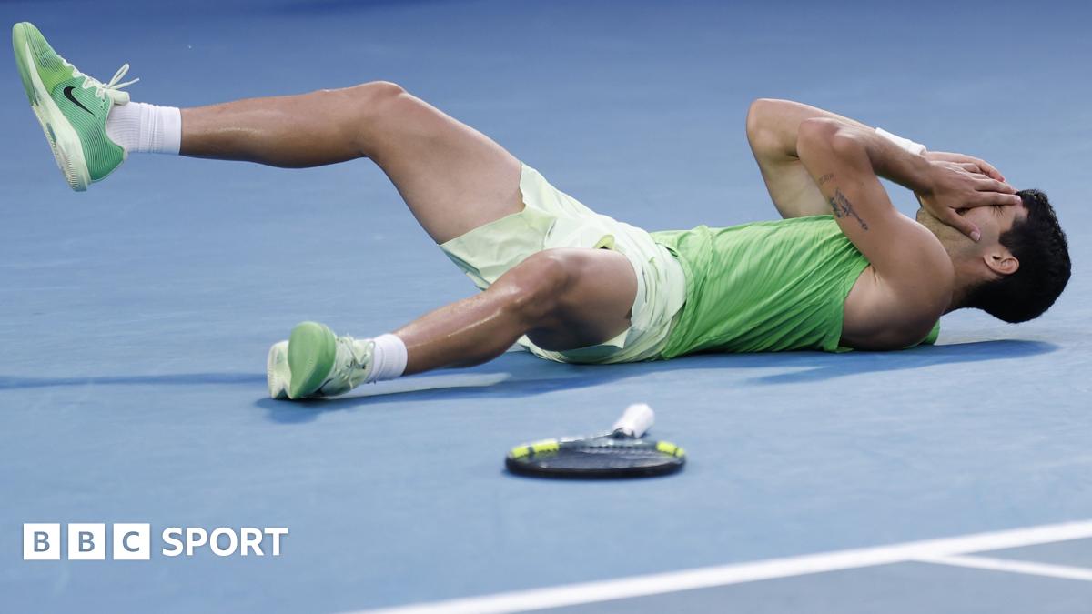 Carlos Alcaraz falls to the floor after beating Alexander Zverev
