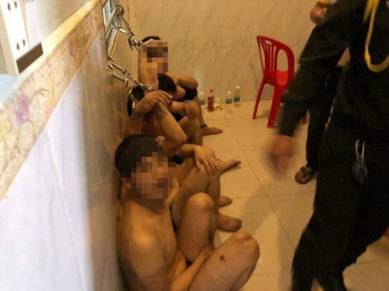 Photos obtained by CNN from Telegram groups used by Cambodia scam networks appear to show detainees restrained inside a compound.
