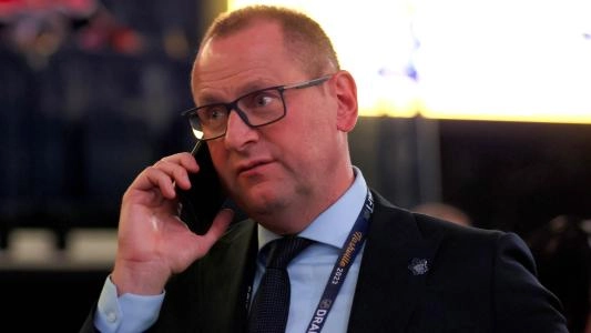 General manager Brad Treliving of the Maple Leafs making calls prior to the NHL draft.