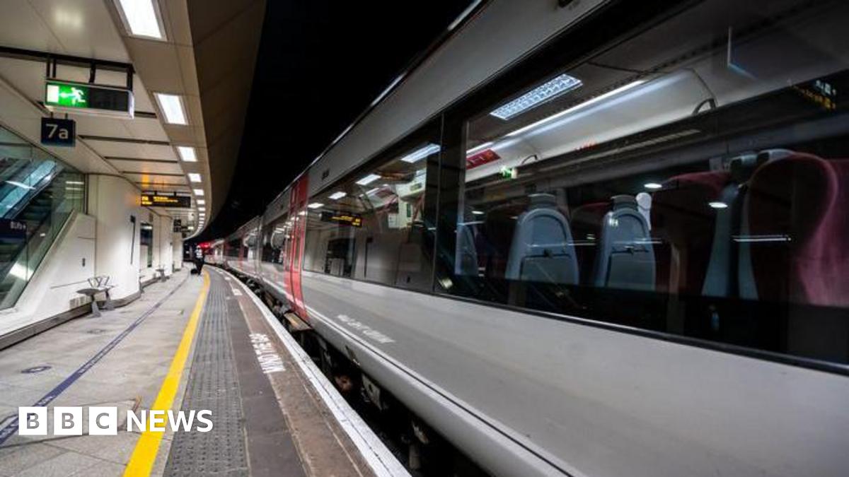 A train stands at a platform at Birmingham New Street.