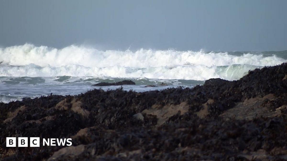 Waves crash upon rocks