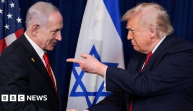 US President Donald Trump (R) points his finger towards Israeli Prime Minister Benjamin Netanyahu (L) as they shake hands during a press conference at Mar-a-Lago, in Palm Beach, Florida (29 December 2025)