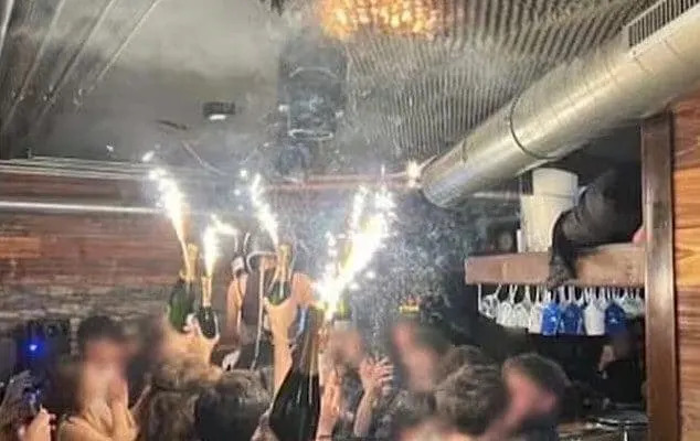The moment the ceiling of the Swiss bar was set ablaze