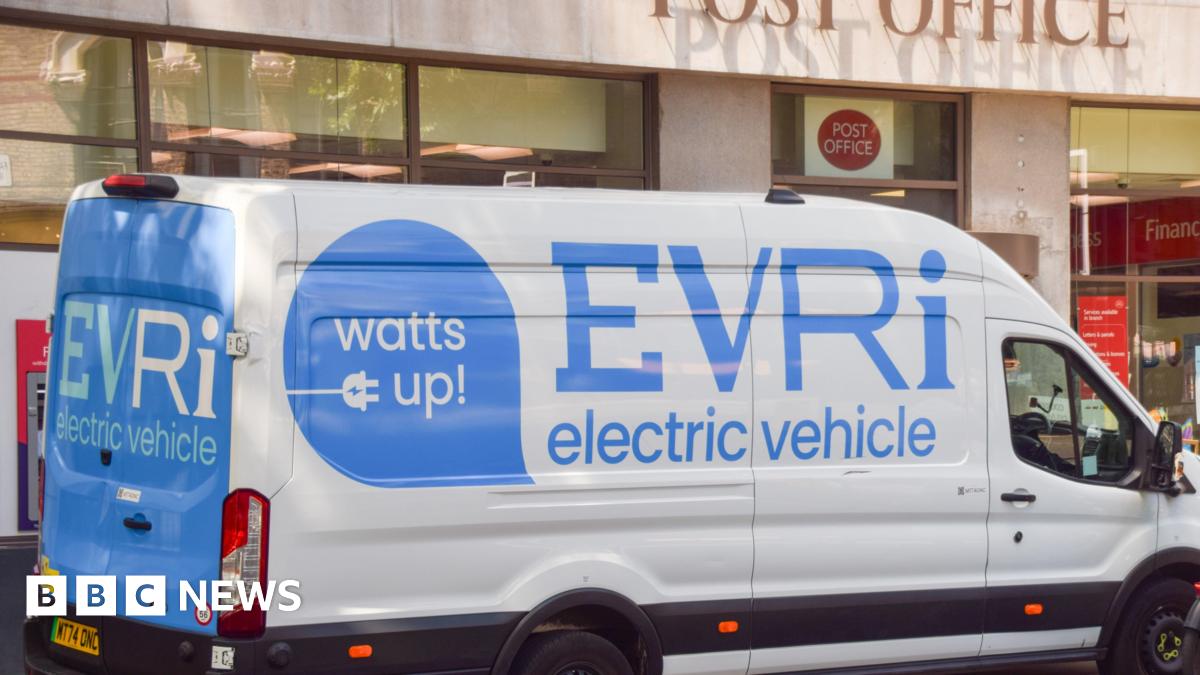 A large white van with blue lettering stating Evri electric vehicle parked outside a Post Office premises