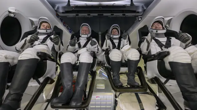 Roscosmos cosmonaut Oleg Platonov, NASA astronauts Mike Fincke, Zena Cardman, and JAXA (Japan Aerospace Exploration Agency) astronaut Kimiya Yui inside the SpaceX Dragon Endeavour