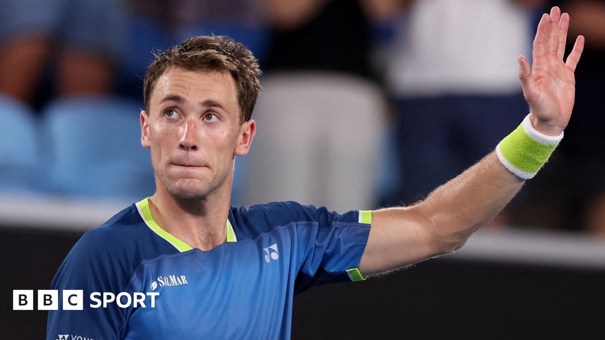 Casper Ruud waves to the crowd on Margaret Court Arena