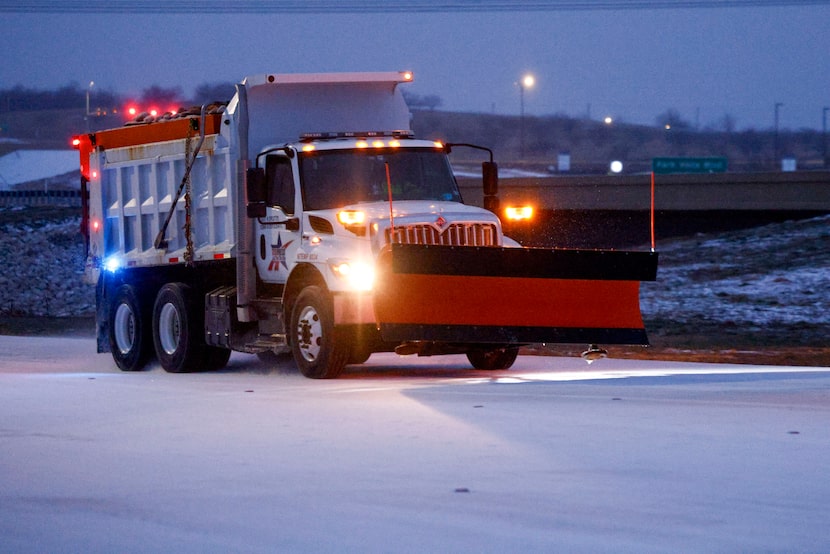 A TEXpress sand truck drives along Alliance Gateway Freeway, Saturday, Jan. 24, 2026, in...