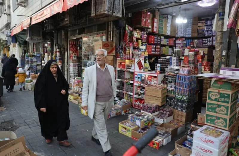 PEOPLE WALK on a street, as protests erupt over the collapse of the currency's value, in Tehran, Iran, January 5, 2026. (credit: MAJID ASGARIPOUR/WANA (WEST ASIA NEWS AGENCY) VIA REUTERS)