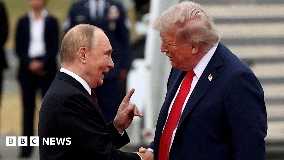 U.S. President Donald Trump shakes hand with Russian President Vladimir Putin, as they meet to negotiate for an end to the war in Ukraine, at Joint Base Elmendorf-Richardson in Anchorage, Alaska, U.S - the two men are shaking hands with Putin using his left hand to also make a pointed gesture