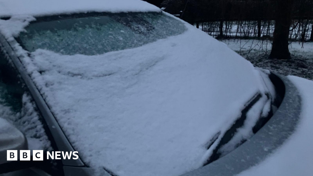 A car windscreen covered in snow