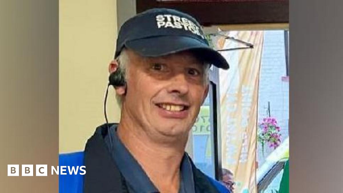 Andrew Rogers wears a dark cap with "street pastor" written on it