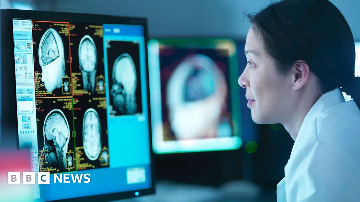 Scientist looking at 3D rendered graphic scans