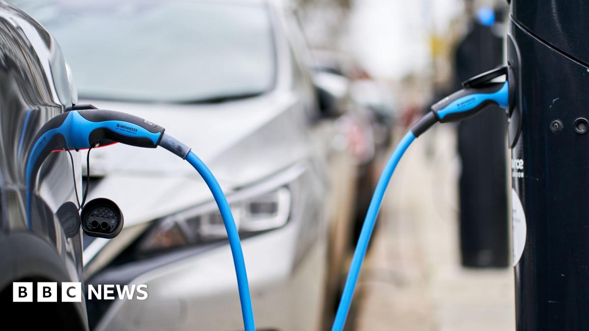 File photo of a Tesla car plugged into a Source London EV charging point in central London.
