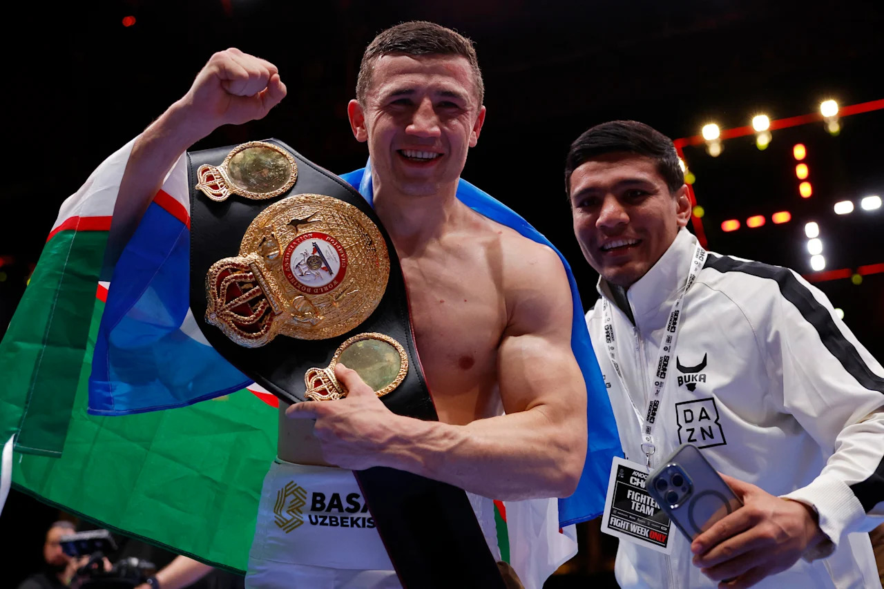 Boxing - Israil Madrimov v Magomed Kurbanov - Kingdom Arena, Riyadh, Saudi Arabia - March 9, 2024 Israil Madrimov celebrates with his WBA World Super Welter belt after winning his fight against Magomed Kurbanov REUTERS/Andrew Couldridge