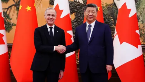 Reuters Carney and Xi shaking hands